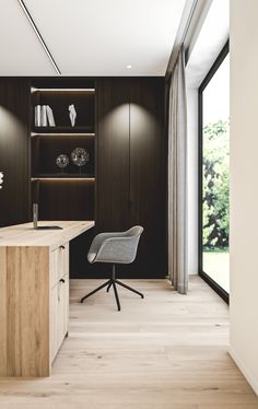 a modern office with wood paneling and glass doors leading to the outside patio area