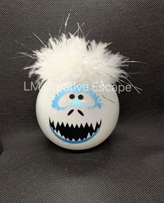 "Abominable snowman inspired shatterproof plastic round glitter ornament ball. Glitter is on the inside of the ornament. Glitter will not get all over your house. Ornament is approximately 3.25\" in diameter. Each ornament is hand made and therefore may look slightly different than the one in the photo. Colors on your screen may appear different than in person. I try to show the colors as accurately as possible." Yeti Snowman, Snowman Outdoor Decorations, Light Bulb Ornaments, Abominable Snowman, Snowman Ornament, Glitter Ornaments, Grade 6, Snowman Ornaments, Christmas Stuff