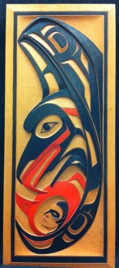 an abstract painting with black, red and blue colors on it's face in a gold frame