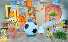 a soccer themed party with balloons and decorations