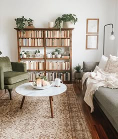 a living room filled with furniture and bookshelves