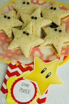 star power cookies are on a plate next to a red and white napkin