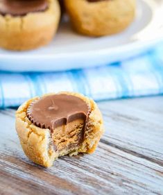 peanut butter cupcakes with chocolate frosting in the middle on a white plate