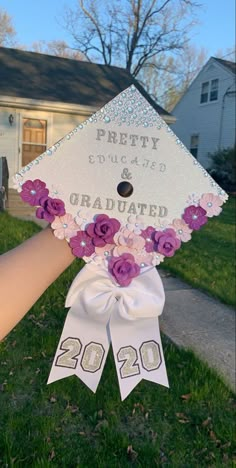 a decorated graduation cap with flowers on it