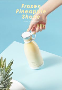 a pineapple shake is being poured into a bottle