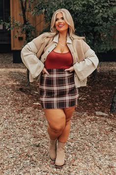 - Stop for a latte in style with this adorable skirt!  - Fully lined brown hued plaid material  - A waistline with side zip closure  - A flattering silhouette that ends in a straight hemlines                                                                                                              Measurements 1XL :  Hip 46", Length 17", Waist 36".  2XL :  Hip 48", Length 17.5", Waist 38".  3XL :  Hip 50", Length 18", Waist 40". Plus Size Fall Outfit Photoshoot, Current Plus Size Fashion Trends, Friendsgiving Outfit Ideas Midsize, Plus Size Romantic Style, How To Wear Skirts In Winter, Plus Size Grunge Outfits 90s, Salem Outfits Fall, Grunge Plus Size Outfits, Plaid Skirt Outfit Fall