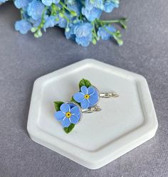 Introducing a stunning Forget-me-nots earrings  that will add a touch of elegance to your wedding or spring ensemble! This dainty and minimalist earrings features delicate Forget-me-nots flowers, which symbolize purity, happiness, and luck. This earrings is perfect for those who appreciate the beauty of nature and want to incorporate it into their jewelry collection. The floral design is crafted with great attention to detail, creating a unique and timeless piece that you will treasure for years to come. Wear it alone for a simple yet sophisticated look, or pair it with other pieces for a layered effect. Whether you're a bride, bridesmaid, or simply a lover of beautiful jewelry, this Forget-me-nots flower earrings is sure to impress. * sizes & materials * Length: about 2 cm ( 0.7 Inches), Forget Me Not Resin Earrings, Forget Me Nots Flowers, Forget Me Nots, Spring Jewelry, Earrings Dainty, Earrings Minimalist, Dainty Earrings, Floral Earrings, Minimalist Earrings