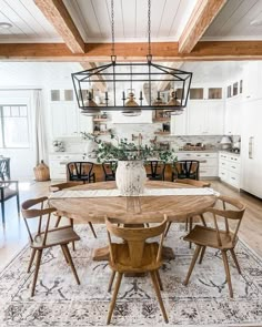 the dining room table is surrounded by wooden chairs and an area rug that looks like it has