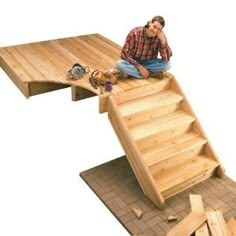 a man sitting on top of a wooden staircase