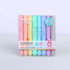 a set of six pastey colored markers in a box with the number eight on it