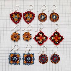 six pairs of crocheted earrings are shown on a white surface with squares and flowers