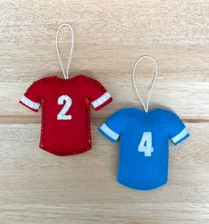 two felt sports jerseys ornament hanging on wood