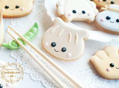 there are some cookies and chopsticks on the table