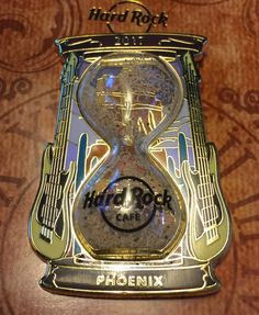 the hard rock cafe clock is on display