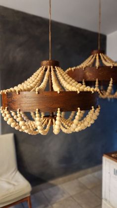 a wooden chandelier hanging from the ceiling