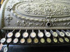 an old fashioned typewriter with numbers on it