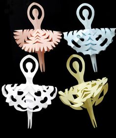 four swan shaped paper clips in different colors