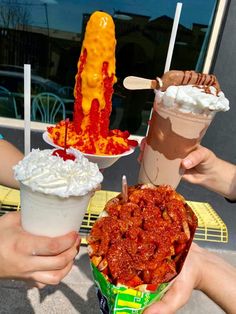 three people are holding up different types of ice cream and desserts in their hands