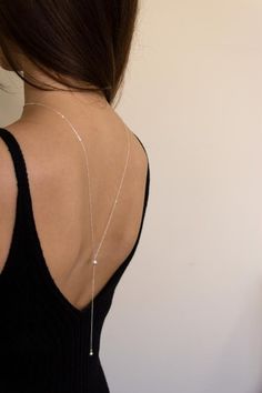 This simple and dainty Back drop necklace features two swarovski crystal pearls and looks great with backless tops and dresses. There is no clasp, it is completely reversible, so you can wear it in the front over a sweater or tee. So lightweight - you won't even know it's on! "PEARL BACK DROP NECKLACE" by GoldenLinings - Christine Elizabeth JewelryD E T A I L S_________________Materials: Sterling Silver or 14k Gold FilledClosure: noneS I Z E S__________Measures 26" (so you can put it over your h Christine Elizabeth, Simple Wedding Jewelry, Minimal Bride, Wedding Jewelry Simple, Diamond Cross Necklace Gold, Floating Diamond Necklace, White Diamond Necklace, Elizabeth Jewelry, Pearl Drop Necklace