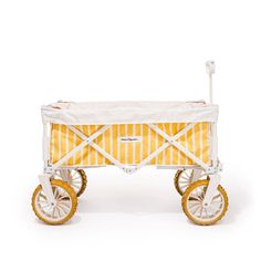 a yellow and white baby's wagon with wheels on the front, sitting against a white background