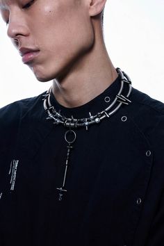 Experience the perfect fusion of futuristic aesthetics and industrial design with our Infiltrator Detachable Necklace. This unique necklace features an intricate chain composed of interconnected metal rings and spheres, creating a striking and modern look. The centerpiece is a detachable elongated pendant, adorned with small metal screws at each connection point, enhancing its industrial charm. This versatile pendant can be removed and worn as an earring, adding functionality to its bold style. Emo Necklace Aesthetic, Adjustable Metal Chain Necklace For Streetwear, Edgy Adjustable Stainless Steel Necklace, Metal Chain Necklace For Streetwear, Cyberpunk Choker, Futuristic Necklace, Futuristic Accessories, Detachable Necklace, Industrial Necklace