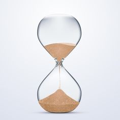 an hourglass with sand running through it and the bottom half being filled with sand