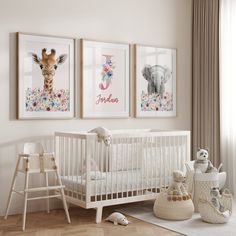 a baby's room with two pictures on the wall and a crib next to it