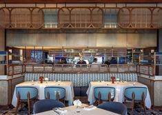 a restaurant with blue and white tables and chairs