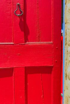 a red door with a metal handle on it