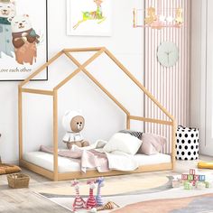 a child's bedroom with a doll house bed and teddy bears on the wall