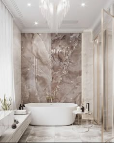 an elegant bathroom with marble walls and flooring, chandelier above the bathtub