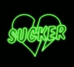 a neon sign that says sucker in the shape of a heart