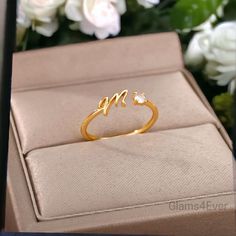 Give a personalized 🎁 gift that will captivate the hearts of your loved ones with this adjustable ring with a beautifully crafted initial in a gold plated finish. It is the perfect choice for people looking for an elegant, refined and original piece of jewelry for an everyday look. 🌟 Material: Copper Alloy Gold plated finish. ☑️ Aesthetic design ☑️ Adjustable size: adjustable to all fingers by gently opening it This ring is the ideal original 🎁 gift for a loved one or simply for yourself. Thi Adjustable Cubic Zirconia Rings For Valentine's Day, Diamond Monogram Initial Ring For Promise, Personalized Diamond Initial Ring For Wedding, Cubic Zirconia Heart Ring For Mother's Day Gift, Mother's Day Gift Cubic Zirconia Heart Ring, Mother's Day Gift Heart Ring With Cubic Zirconia, Silver Cubic Zirconia Initial Ring For Wedding, Adjustable Couple Rings With Cubic Zirconia For Wedding, Gold Sterling Silver Initial Open Ring