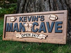 a wooden sign that says kevin's man cave on it