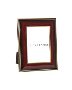 a red and gold frame with the words lucyframes on it's side