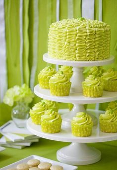 a cake and cupcakes on a table