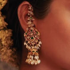 Embodying grace and sophistication in every detail are our exquisite 22K gold embossed drops. Featuring delicate peacock motif jadau designs, these drops are paired with fine rows of valanda, ruby, and emerald ear chains. WhatsApp 9964641869 for enquiries. 📍Visit the Blue CKC&Co. Flagship store , near Safina Plaza. Look for the DIAMOND logo! Featuring: @ciashetty Saree: @aikyatha Carpet: @carpetkingdomindia Hair and Makeup: @makeupbyshwethamahadev #CKCCo #JewelleryLovers #InstaJewellery ... Diamond Matilu Designs, Maatilu Designs Gold, Diamond Jhumkas Indian, Gold Ear Jewelry, Gold Jhumka Designs, Indian Gold Jewellery, High Jewelry Design, Fashion Jewelry Necklaces Gold, Peacock Motif