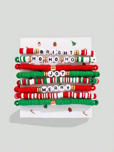 four christmas bracelets with the words bright, hot, ho ho ho and joy merry written on them