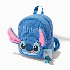 a blue backpack with stitch on it