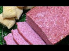 several different types of meats on a plate with green grass in the back ground