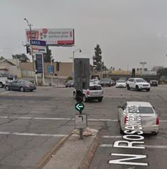 an intersection with cars parked on the street