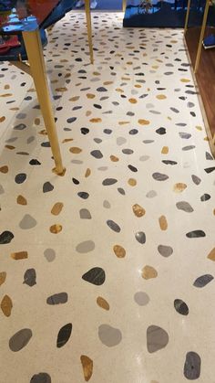 the floor is painted with gold and black dots