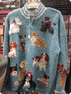 a blue sweater with dogs on it