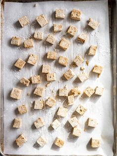 tofu cubes on a baking sheet ready to be cooked and put into the oven