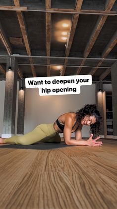 a woman is doing yoga on the floor