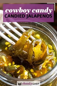 a jar filled with pickled jalapenos on top of a table