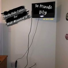 two signs that are on the wall in a room with wires attached to each sign