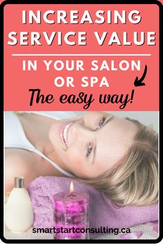 a woman laying on top of a pink towel next to a bottle of lotion