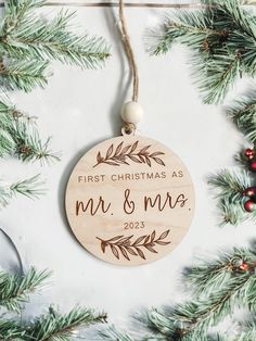 a wooden ornament hanging from a christmas tree