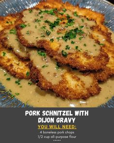 pork schnitzel with dill gravy on a blue plate